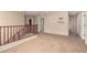 Upstairs landing area with carpeting and wood railing at 17358 N 185Th Ln, Surprise, AZ 85374
