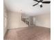 Open living room space featuring tile flooring, neutral paint colors, and modern light fixture at 17358 N 185Th Ln, Surprise, AZ 85374