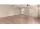 Spacious living room with tile floors, neutral paint, lots of natural light, and modern light fixtures at 17358 N 185Th Ln, Surprise, AZ 85374