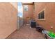 A small side yard with neutral-colored stucco, gravel, and visible air conditioning units at 17358 N 185Th Ln, Surprise, AZ 85374