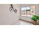 Bright dining area with tile floors, decorative wall art, and a large window overlooking a private outdoor space at 17443 N 99Th N Dr, Sun City, AZ 85373