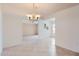 Bright dining area with tile floors and decorative accents, seamlessly connecting to other living spaces at 17443 N 99Th N Dr, Sun City, AZ 85373
