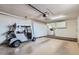 Spacious garage with a golf cart and laundry machines at 17443 N 99Th N Dr, Sun City, AZ 85373