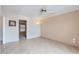 The living room has tile flooring, paneled walls, and a ceiling fan at 17443 N 99Th N Dr, Sun City, AZ 85373