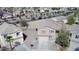 Wide aerial view of a two-story home, highlighting its spacious lot and proximity to local neighborhood amenities at 18856 N Comet Trl, Maricopa, AZ 85138