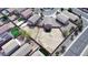 An elevated aerial view reveals a generous backyard space surrounded by neighboring homes and block wall fencing at 18856 N Comet Trl, Maricopa, AZ 85138