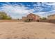 Spacious backyard, with ample room for landscaping and a small patch of artificial turf, offering a blank canvas at 18856 N Comet Trl, Maricopa, AZ 85138
