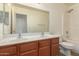 Bathroom featuring double sinks and a shower/tub combo at 18856 N Comet Trl, Maricopa, AZ 85138