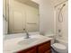 A bathroom featuring a vanity, toilet, and shower/tub combo at 18856 N Comet Trl, Maricopa, AZ 85138