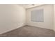 Bedroom featuring neutral carpet and a window at 18856 N Comet Trl, Maricopa, AZ 85138