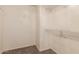 Spacious walk-in closet with carpet and wire shelving for organized storage at 18856 N Comet Trl, Maricopa, AZ 85138