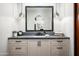 Powder room with a vessel sink, elegant mirror, and modern finishes at 18886 N 101St Way, Scottsdale, AZ 85255