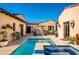 Private courtyard with a pool, outdoor seating, and desert landscaping at 18886 N 101St Way, Scottsdale, AZ 85255