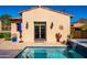 Backyard pool with surrounding patio, landscaping, and desert views at 18886 N 101St Way, Scottsdale, AZ 85255