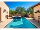 Beautiful pool and spa with stone accents and patio area perfect for relaxation and entertaining guests at 18886 N 101St Way, Scottsdale, AZ 85255