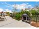 Cozy backyard seating area with fire feature, mature landscaping, and desert foliage at 1954 E Vista Dr, Phoenix, AZ 85022