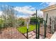Cozy fenced backyard featuring low-maintenance landscaping, artificial grass, and a rock garden with a calming ambiance at 1954 E Vista Dr, Phoenix, AZ 85022