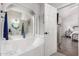 Relaxing bathroom with soaking tub, arched mirror, and access to the main bedroom at 1954 E Vista Dr, Phoenix, AZ 85022
