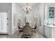 Bright dining nook featuring natural light, stylish decor, a chandelier, and a breakfast table at 1954 E Vista Dr, Phoenix, AZ 85022