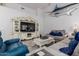 Spacious living room offering plush seating, neutral tones, and a decorative entertainment center at 1954 E Vista Dr, Phoenix, AZ 85022