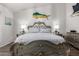 Comfortable main bedroom features decorative bed frame and matching bedside tables at 1954 E Vista Dr, Phoenix, AZ 85022