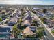 An aerial view of a suburban neighborhood featuring manicured lawns and mature trees at 20497 E Appaloosa Dr, Queen Creek, AZ 85142