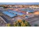 Overhead view of horse property featuring multiple stalls, covered areas and riding arenas at 20497 E Appaloosa Dr, Queen Creek, AZ 85142