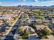 An aerial view of a well-planned suburban neighborhood, featuring manicured lawns and mature trees at 20497 E Appaloosa Dr, Queen Creek, AZ 85142