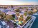 Beautiful aerial view showcasing the home's well-maintained yard, pool, and putting green at 20497 E Appaloosa Dr, Queen Creek, AZ 85142