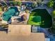 Aerial view of a home showcasing the pool, putting green, landscaping and roof at 20497 E Appaloosa Dr, Queen Creek, AZ 85142