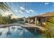 Relaxing backyard area featuring a pool, outdoor seating, and covered patio, ideal for leisure and gatherings at 20497 E Appaloosa Dr, Queen Creek, AZ 85142