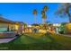 Stunning backyard with putting green, inviting pool, and spa, perfect for outdoor entertaining and relaxation at 20497 E Appaloosa Dr, Queen Creek, AZ 85142