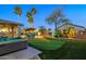 Amazing backyard with putting green, sparkling pool, and spa, creating a perfect outdoor retreat for relaxation and fun at 20497 E Appaloosa Dr, Queen Creek, AZ 85142