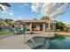 Relaxing backyard area featuring a pool, outdoor seating, and covered patio, ideal for leisure and gatherings at 20497 E Appaloosa Dr, Queen Creek, AZ 85142