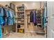 Well-organized walk-in closet with ample storage and shelving for clothes, shoes, and accessories at 20497 E Appaloosa Dr, Queen Creek, AZ 85142