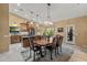 Open dining room featuring wood table with chairs, chandelier, and views to the outdoors at 20497 E Appaloosa Dr, Queen Creek, AZ 85142