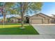 Charming home featuring a well-manicured lawn, a two-car garage, and a welcoming entrance at 20497 E Appaloosa Dr, Queen Creek, AZ 85142
