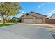 Home with a spacious driveway, a two-car garage, and low-maintenance landscaping at 20497 E Appaloosa Dr, Queen Creek, AZ 85142