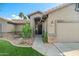Inviting front entrance with well-kept landscaping and a decorative door at 20497 E Appaloosa Dr, Queen Creek, AZ 85142