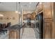 Spacious kitchen featuring custom wood cabinetry, a large island, granite countertops, and stainless steel appliances at 20497 E Appaloosa Dr, Queen Creek, AZ 85142