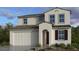 Charming two-story home with a two-car garage and neutral-colored stucco exterior at 25192 N 172Nd Dr, Surprise, AZ 85387