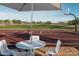 Outdoor basketball court with picnic tables, a lush green field, and clear blue skies for recreational activities at 25339 N 19Th Ln, Phoenix, AZ 85085