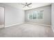 Bright bedroom featuring carpeted floors and large windows with blinds at 25339 N 19Th Ln, Phoenix, AZ 85085