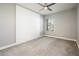 Inviting bedroom featuring a shiplap accent wall, plush carpet, and neutral wall paint at 25339 N 19Th Ln, Phoenix, AZ 85085