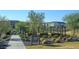 Community garden with raised garden beds and a variety of plants, providing a serene and green space for residents at 25339 N 19Th Ln, Phoenix, AZ 85085