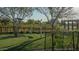 Lush community lawn area with pull-up bars and vine-covered trellis, perfect for outdoor recreation at 25339 N 19Th Ln, Phoenix, AZ 85085