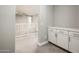 A finished hallway with built in storage, neutral color palate, and plush carpeting at 25339 N 19Th Ln, Phoenix, AZ 85085