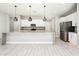 Well-equipped kitchen featuring a center island with seating, stainless steel appliances, and ample counter space at 25339 N 19Th Ln, Phoenix, AZ 85085
