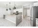 Bright kitchen featuring a large island, granite countertops, and stainless steel appliances at 25339 N 19Th Ln, Phoenix, AZ 85085