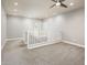 Upstairs loft space with carpeted floors and a staircase railing at 25339 N 19Th Ln, Phoenix, AZ 85085
